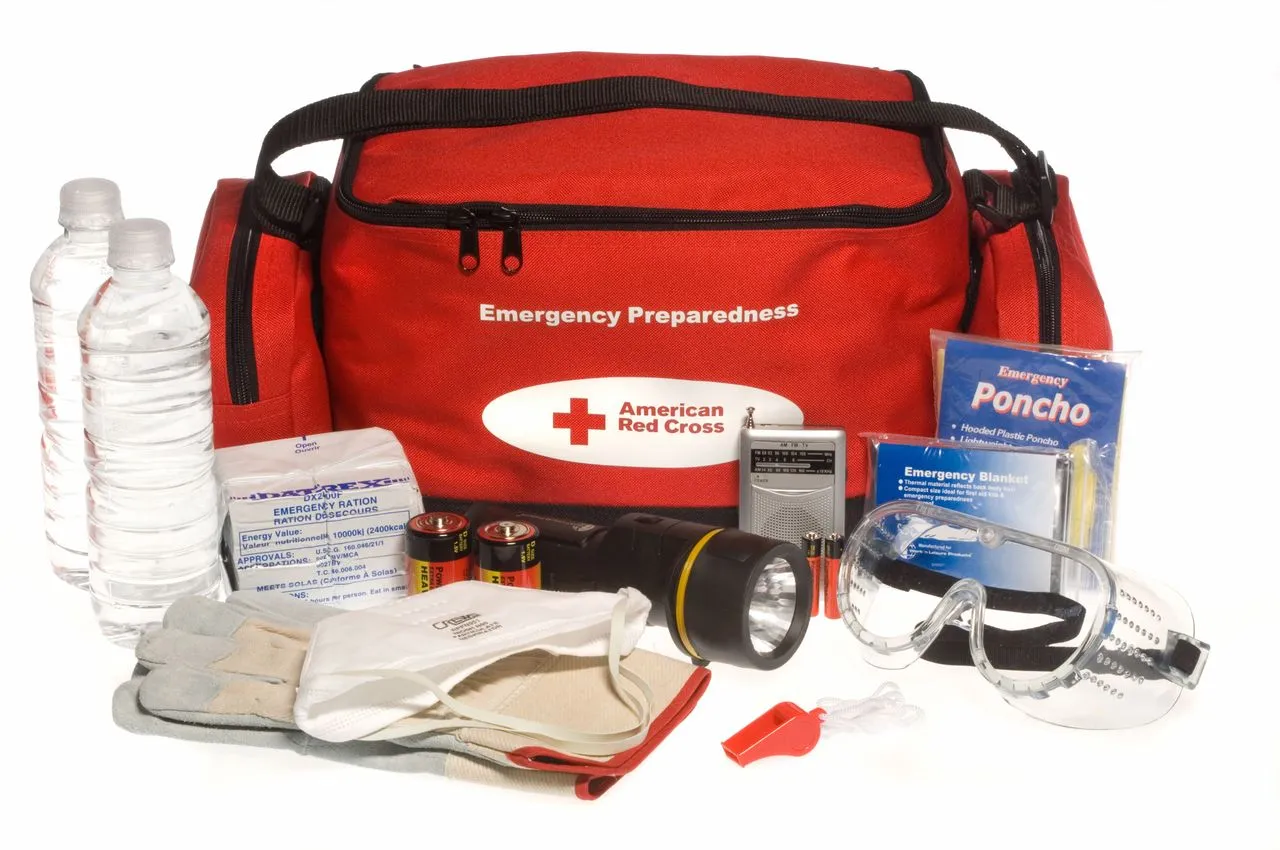 Red Cross emergency go bag with its contents laid out and ready for evacuation